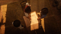 From left to right, Lenny, Dutch and Arthur looking over a map of the city of Saint Denis