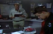 Captain Hollister asks Lister about his cat in his adjacent office