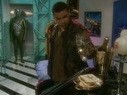 Legion shows Dave Lister to his "cell" in the his space station, which includes sugar puff sandwiches ("Legion", Series VI)