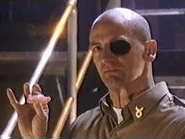 Mr. 'Nicey' Ackerman, the Warden of The Tank, addresses the prisoners