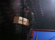 Frank finds the baby Lister under the Grav-Pool table