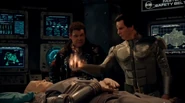 Rimmer prepares to use the Anubis Stone to bring Kryten back to life