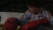 A young Rimmer in Io House, replete with over-starched pajamas and nocturnal boxing gloves ("Timeslides", Series III)