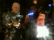 Bazookoid-Psirens-MKI-II.jpg (176 KB) Blasting a Psiren. Kryten is holding a pistol-style bazookoid, Cat a rifle-style bazookoid ("Psirens")