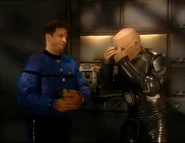 After catching Kryten's eyes with a baseball glove, Kryten puts them back in