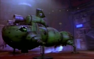 Starbug flies into a gigantic hangar filled with massive new 'bugs as the nanobots recreate Red Dwarf ("Nanarchy", Series VII)