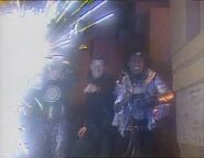 Kryten blasts off a bazookoid in the cargo bays as they posse hunt for the polymorph ("Polymorph")