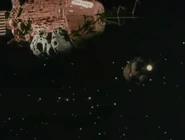 Rimmer returning to Red Dwarf from Lanstrom's planet in an ore sample pod ("Quarantine", Series V)