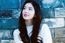 Irene by a brick wall