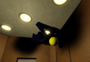 JAOBA crawling across the ceiling during an elevator event.