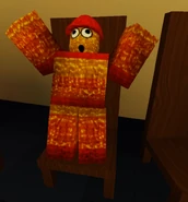 The Roblox gear Birthday Pinata on a chair.
