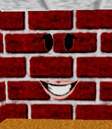The Roblox face Smiling Girl on a wall.