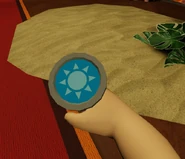 The useless coin being inspected.