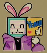 Melanie holding up a sign that says, "YEAH!"