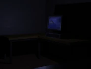 A close-up of the computer, which is displaying an image of the Earth spinning.