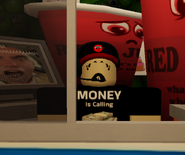 Emerson, who wears a t-shirt with the words "MONEY Is Calling", and has the "WHAAAaaa!" face.