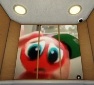 Skweezy Jibbs holding a Distressed Red Ball close up to the camera.