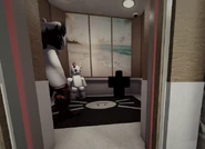 The Interloper in the elevator.