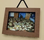 Another painting in the room, with what looks like a room full of mushrooms on the floor and a cat.