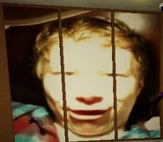 A person looking at the camera with a very bright light source.