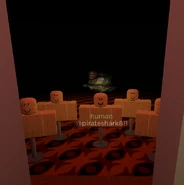 A RockMan appearing behind the mannequins.