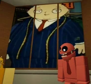 Stewie Griffin wearing a large suit.