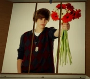 Justin Biever holding flowers.