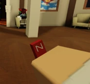 A player holding the Mini-Magnet in first-person