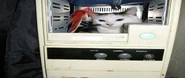 A kitty in an old computer case[6]