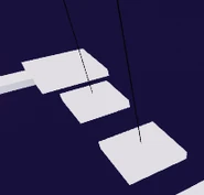 Two wobbly, square platforms held up by a rope in the middle.