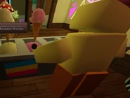 The upside-down pansexual flag behind Crem's counter.