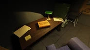 Credits Folder.png (1.44 MB) The folder with the game credits on it seen on the desk in the projector room.