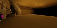 A giant pipe room containing some stairs, which lead to a locked office below. An abyss of darkness can also be seen in this room layout. This is a reference to the Incinerator map from Gang Beasts.