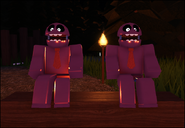 Ditto, but sitting together on a log in Two Stud Camp. (Due to the lighting they appear purple.)