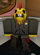 NULL wearing an aroace pride badge for pride month.