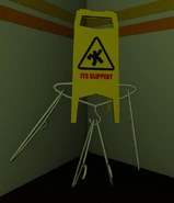 Slippery sign guy.png (218 KB) A humanoid made out of a slippery sign and hangers, found in the corner.
