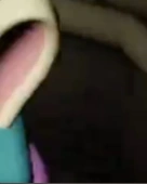 A tiny part of Melanie's ear, seen through a teaser.