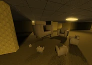 A circle of differently-sized chairs.