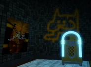 Graffiti of a strange bipedal cat creature done with orange spray paint.