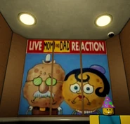 SpongeBob's parents feeling sad with a caption saying that this is a, "LIVE MOM AND DAD REACTION".