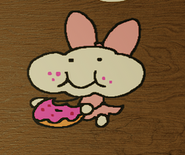 Mozelle eating a donut happily