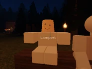 Lampert sitting near the campfire in the Two Stud Camp.