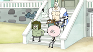 S6E09.005 Muscle Man Takes His Shirt Off