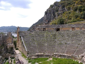 Roman theatre of Myra, with the rock-cut tombs of the ancient Lycian necropolis on the cliff in the background.