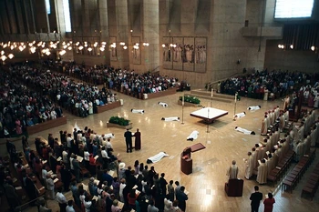 Roman Catholic deacon candidates prostrate before the altar of the Cathedral of Our Lady of the Angels in Los Angeles during a 2004 diaconate ordination liturgy.