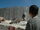 Boy and soldier in front of Israeli wall.jpg
