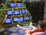A contestant looking at the nine television sets in season 4.