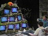 A contestant looking at the nine televisions sets in season 2.