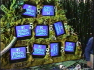 A close-up of the nine TV screens on the wall.