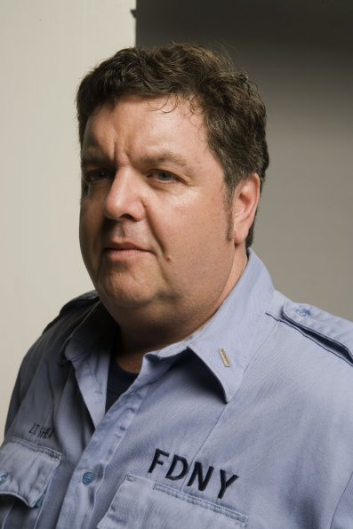 John Scurti as Lt. Kenny 'Lou' Shea